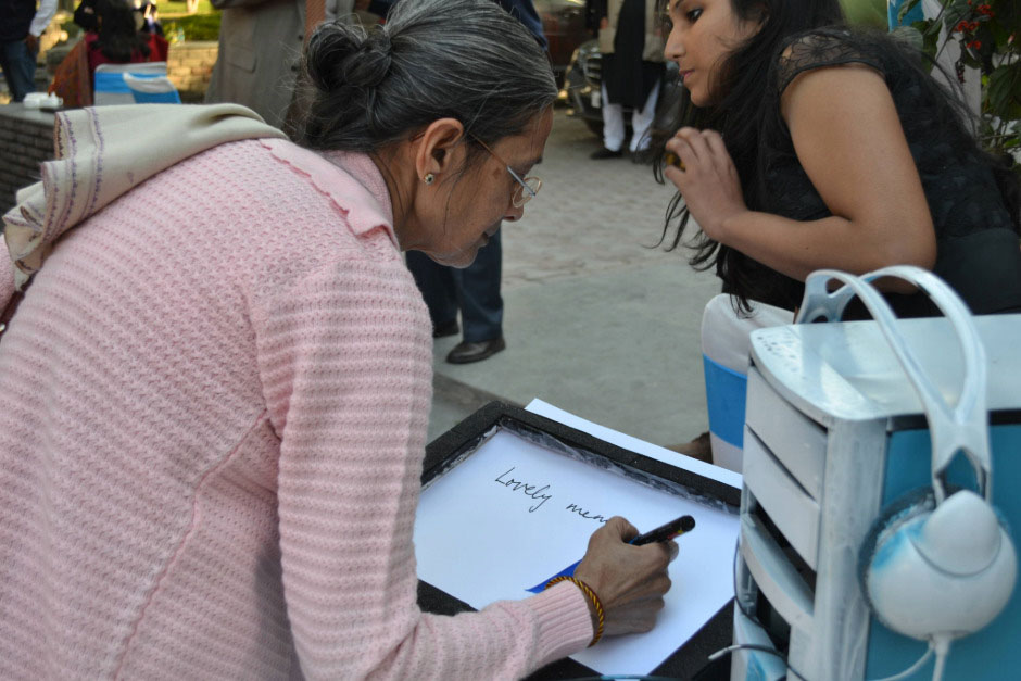 Guests at the event marking their footprints and writing their messages